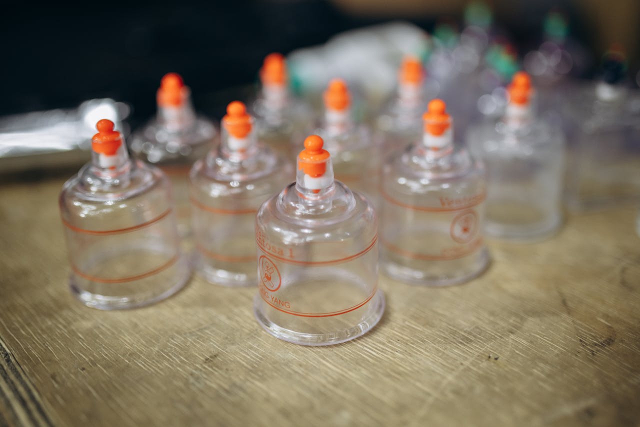 gallery-1 Close-up view of multiple cupping therapy cups used for massage and muscle recovery.