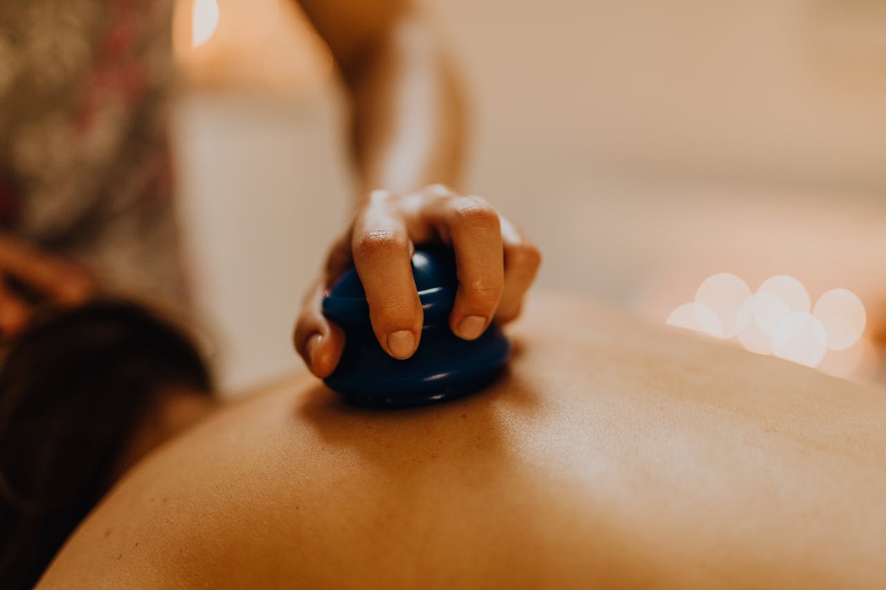 our-services-1 Close-up of cupping therapy on a person's back, focusing on relaxation and wellness.